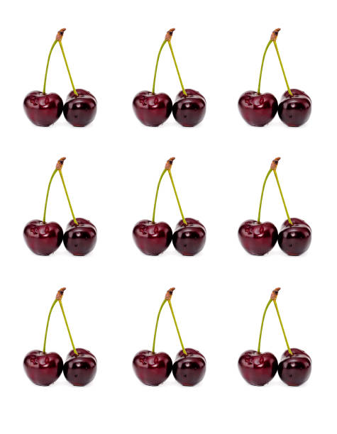 istock Sweet red cherries isolated on white background. Top view. Flat lay pattern 1128947098
