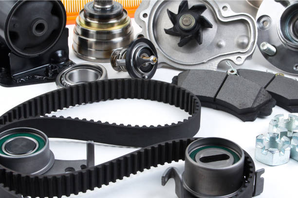 istock Auto parts background. Hub, pump, brake pads, filter, timing belt, rollers, constant velocity joints, thermostat and other on white background. Set of spare parts for repair 1128947503