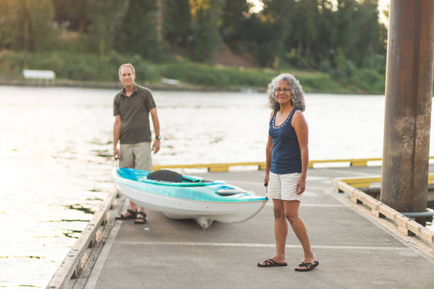 istock A senior couple prepares to go river kayaking 1128948392