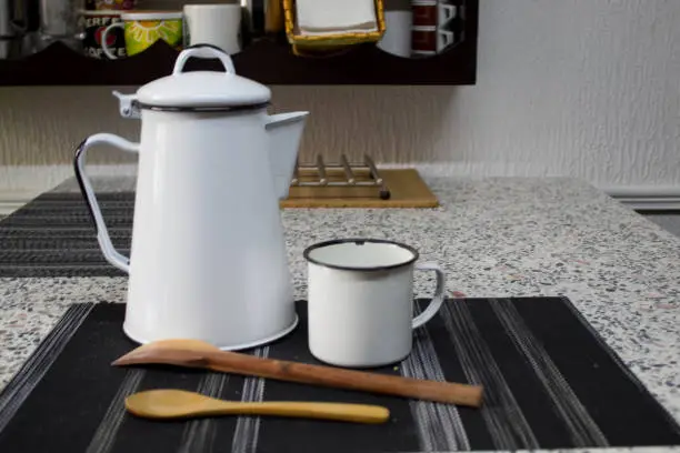 white kettle with a white mug