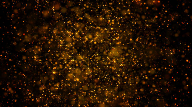 istock gold glitter particular slow motion moving on black background, luxury dream celebration idea concept 1128949520