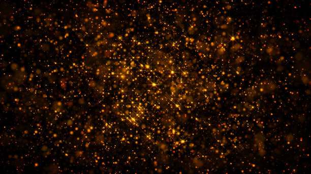 istock gold glitter particular slow motion moving on black background, luxury dream celebration idea concept 1128949557