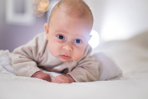 istock Newborn child relaxing in bed. 1128950443