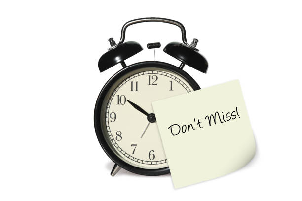 istock Alarm clock time note reminder don't miss isolated on white background 1128950513