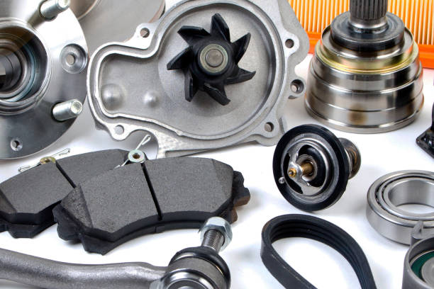 istock Auto parts background. Hub, pump, brake pads, filter, timing belt, rollers, constant velocity joints, thermostat and other on white background. Set of spare parts for repair 1128951044