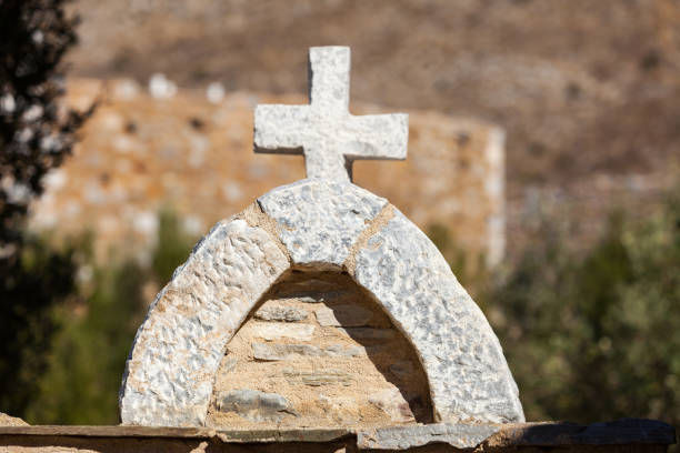 istock Greek stone cross on burial ground 1128951176