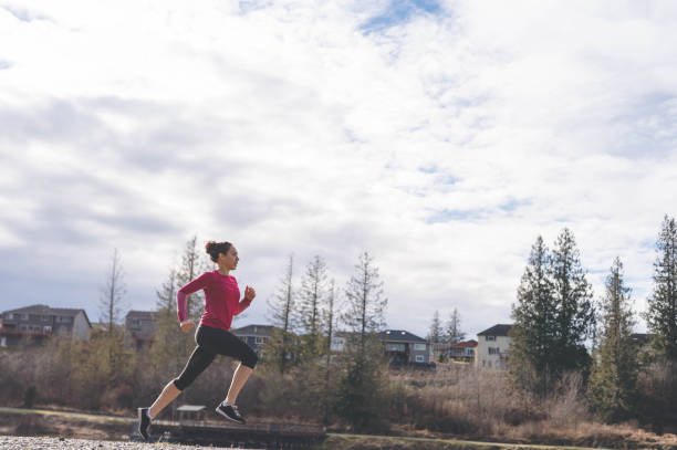 istock A young Eurasian woman goes for a training run next to a lake 1128951223