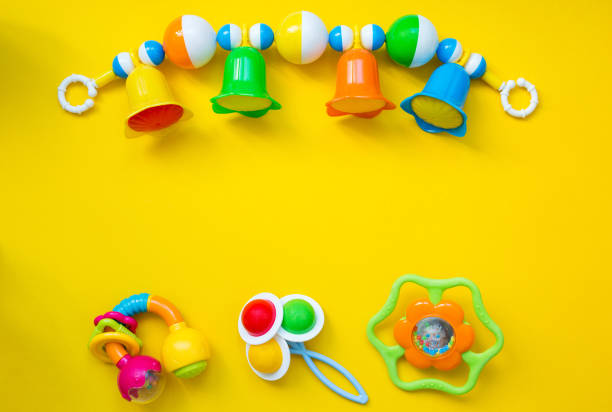 istock Various children's items for the game on a yellow background. Copy space and top view. 1128952355