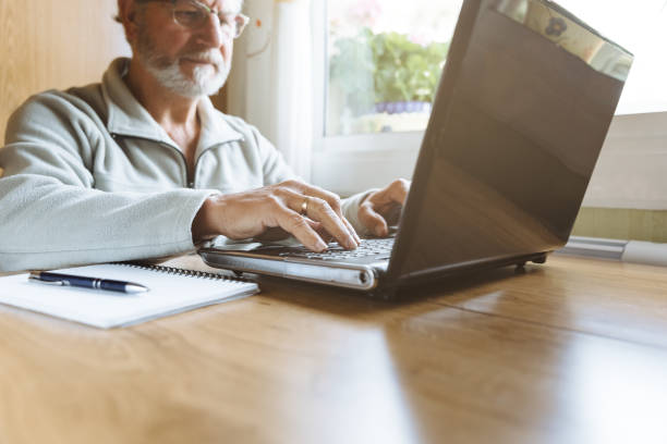 istock Senior man working with his laptop at home 1128952366