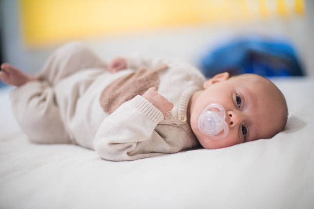 istock Newborn child relaxing in bed. 1128954166
