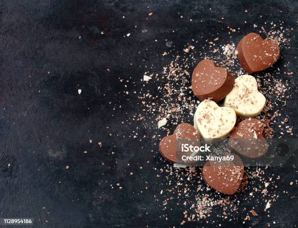 Valentines Day Background Chocolate Dark And White Hearts Stock Photo - Download Image Now