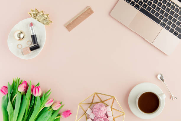 Flat lay and top view of female office table desk