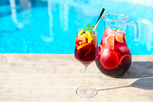 Refreshing classic fruit sangria (punch) by the pool