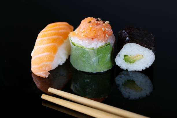 istock Fresh seafood sushi meal on darck background 1128964486