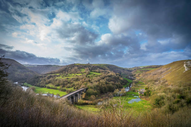 Monsal Dale Derbyshire Peak District Monsal Dale, the River Wye and the Headstone Viaduct viewed from the top of Monsal Head, Bakewell, Derbyshire derbyshire photos stock pictures, royalty-free photos & images