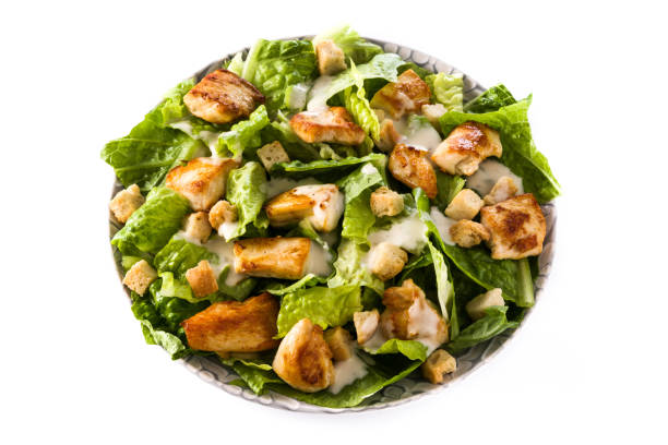 istock Caesar salad with lettuce,chicken and croutons 1128967772