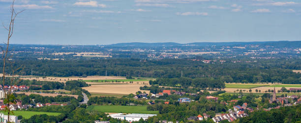 istock A city landscape in Germany. Buildings and arable fields. 1128967798