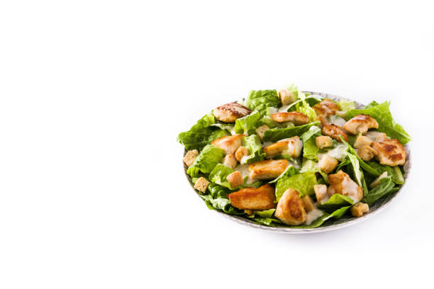 istock Caesar salad with lettuce,chicken and croutons 1128967880