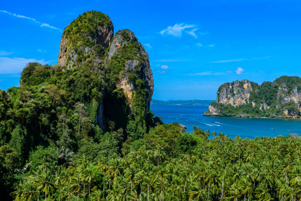istock Beautiful view on Railay west beach from view point. Tropical beach with karst rock formations on the paradise coast - Railay, Krabi, Thailand. 1128968227