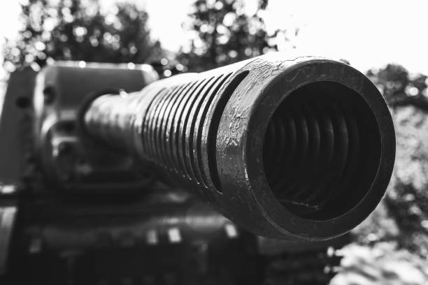istock Old tank from the Second World war standing outdoors in the green forest. Armored fighting vehicle as a memory monument in peaceful times. No war concept. 1128968253