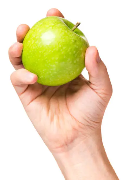 Photo of Hand with green apple