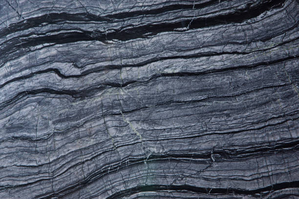 istock A beautiful natural stone background of gray marble with dark stripes is called Silver Wave 1128971207