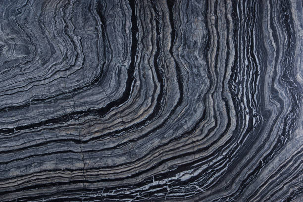 istock Natural marble stone gray with black and white stripes, reaching a semicircle, called Silver Wave 1128971209