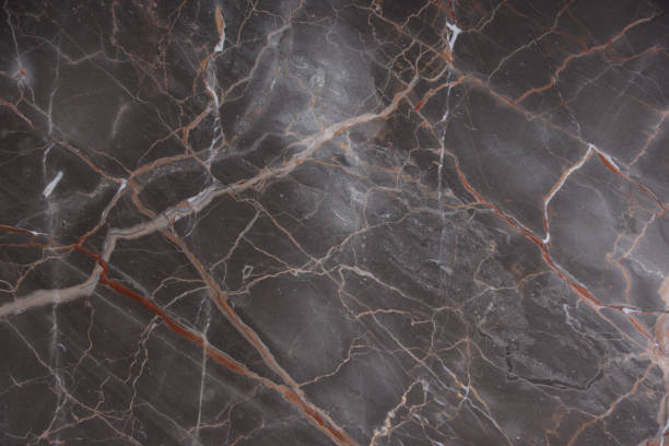istock Brown marble with pink and red veins, called Caravaggio 1128971211
