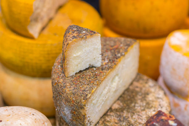 istock Craft cheese. Cheese head. Artisan cheese 1128971554