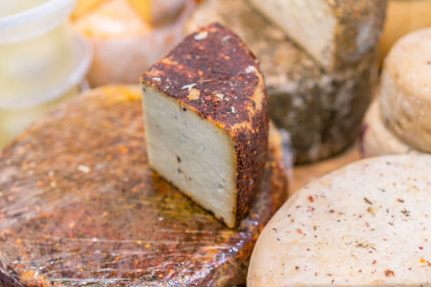 istock Craft cheese. Cheese head. Artisan cheese 1128972778