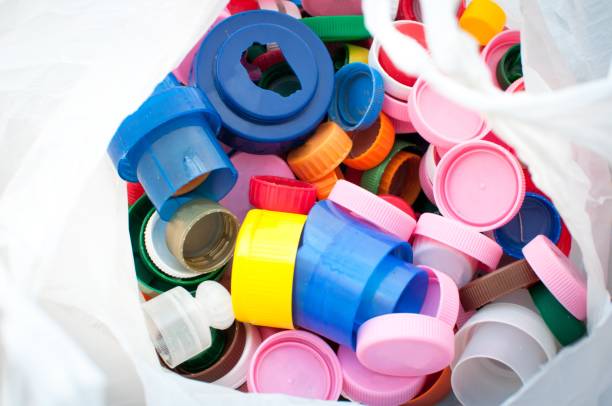 istock colorful plastic bottle caps ready for recycling 1128972896