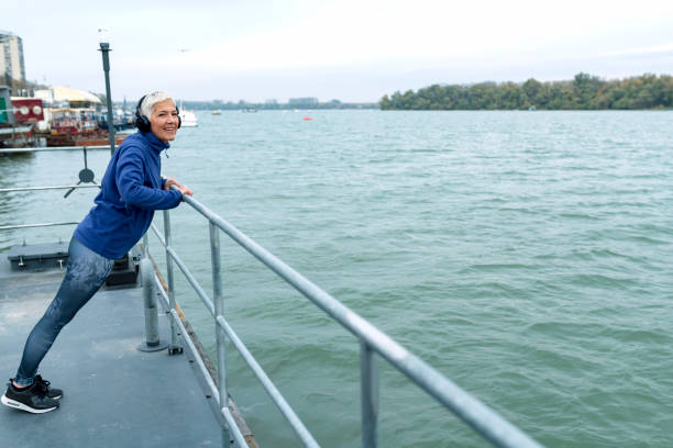 istock Mature Woman Exercising Near the River 1128973111