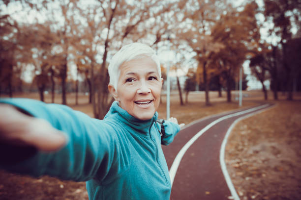 istock Mature Woman Preparing for Workout 1128973165