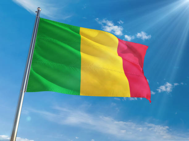 Mali National Flag Waving on pole against sunny blue sky background. High Definition Mali National Flag Waving on pole against sunny blue sky background. High Definition Mali stock pictures, royalty-free photos & images