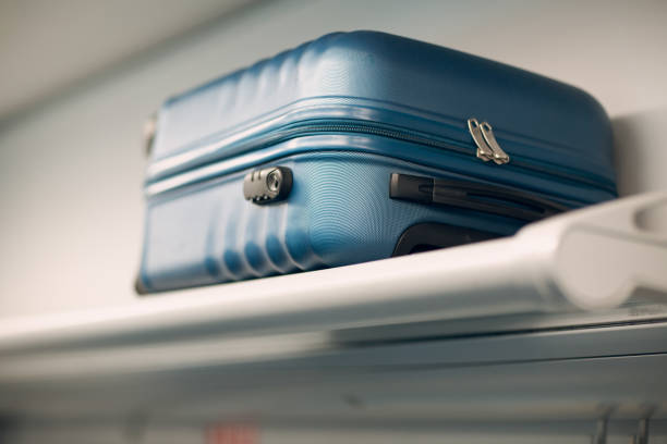 istock Luggage on shelf railway train. 1128977563