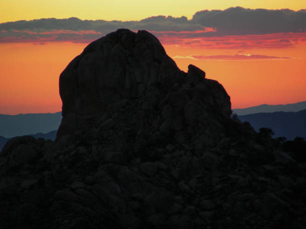istock Sunset Silhouette in the Midhills 1128979244