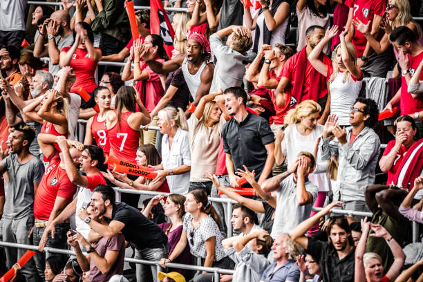 istock Excited crowds on a football stadium 1128980887