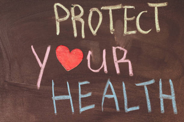istock Handwriting  text : protect  your health with colorful chalk 1128980960