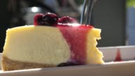 istock Cutting cheesecake in slow motion 1128981184