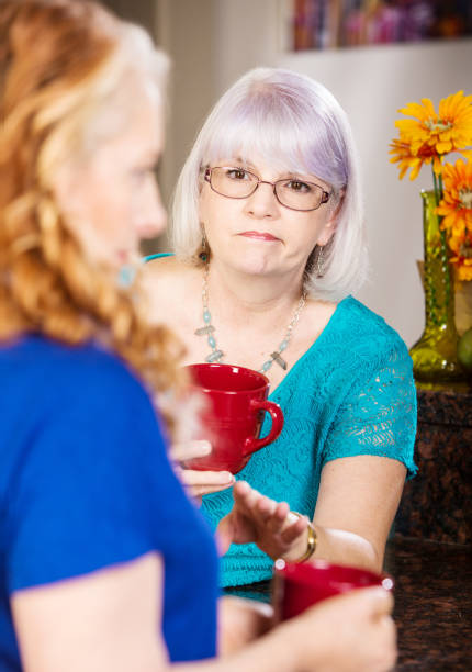 istock Compassionate Woman Listens to Friend 1128982106
