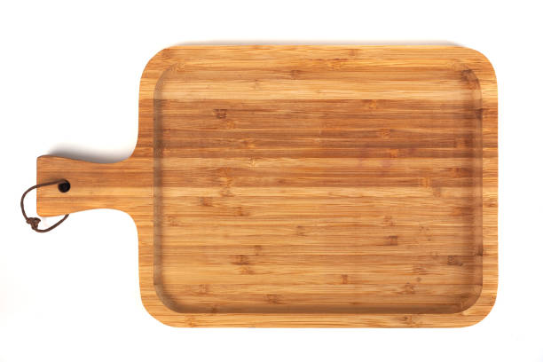 istock wooden cutting board isolated on white background 1128983507