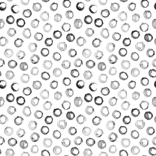 Vector illustration of Fine faded circles hand-painted with diluted ink and brush - non-ideal shapes and traces of paint give the work a unique look - seamless illustration in vector in shades of black and white on paper background