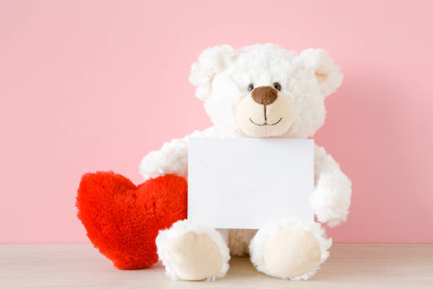 Stuffed animal and hearts.