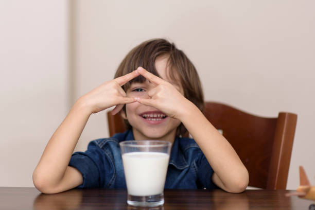 istock Little boy is drinking milk 1128987134