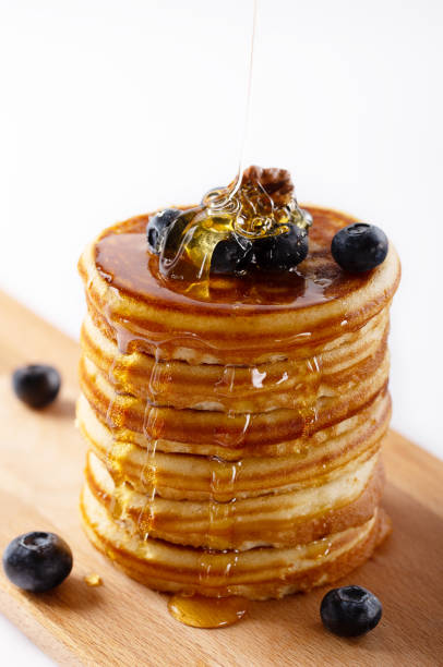 istock Fresh homemade pancakes with blueberries and syrup 1128990759