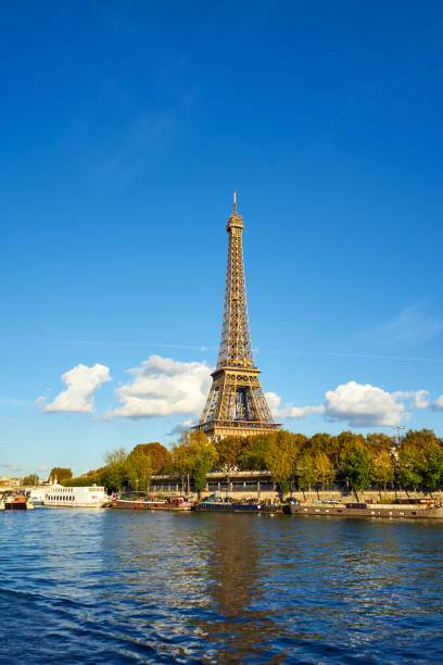istock Eiffel Tower Taken From A Boat At Seine River 1128990768