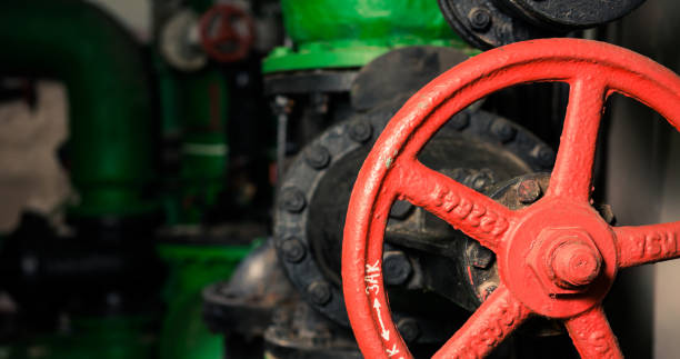 istock water supply pipes with red valves 1128991724