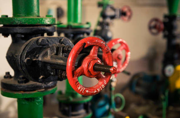 istock water supply pipes with red valves 1128991763