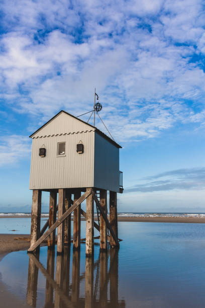 istock Drowning house at the beach 1128994223