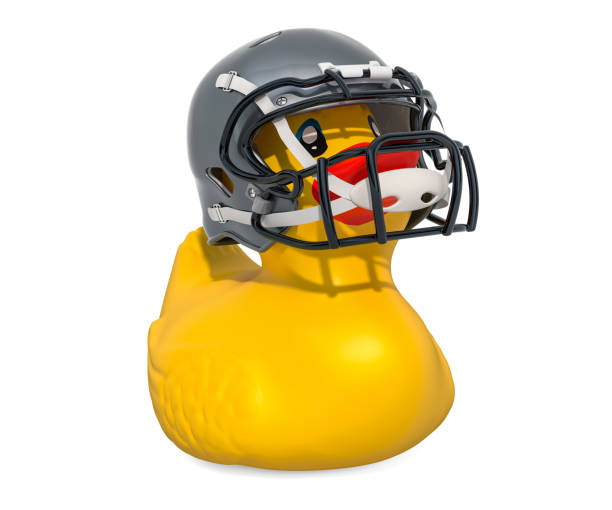 fußball spieler rubber duck, 3d-rendering isolierten auf weißen hintergrund - football helmet american football yellow american football uniform stock-fotos und bilder